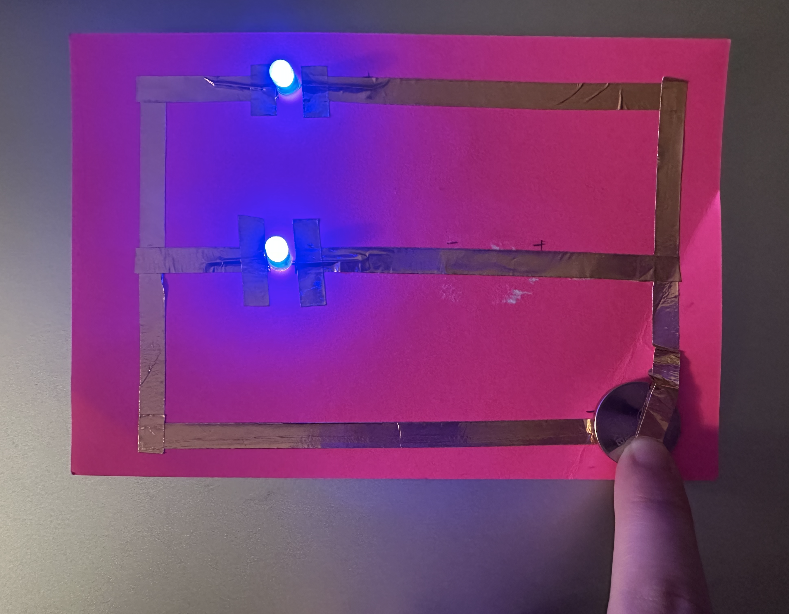 This is a parallel circuit. I used the same process as before and it also worked well. I noticed that if I wanted both LEDs to light up at the same time, they needed to be the same color. Different colors have different voltage requirements, which I noticed when I was looking to buy more LEDs on Amazon.