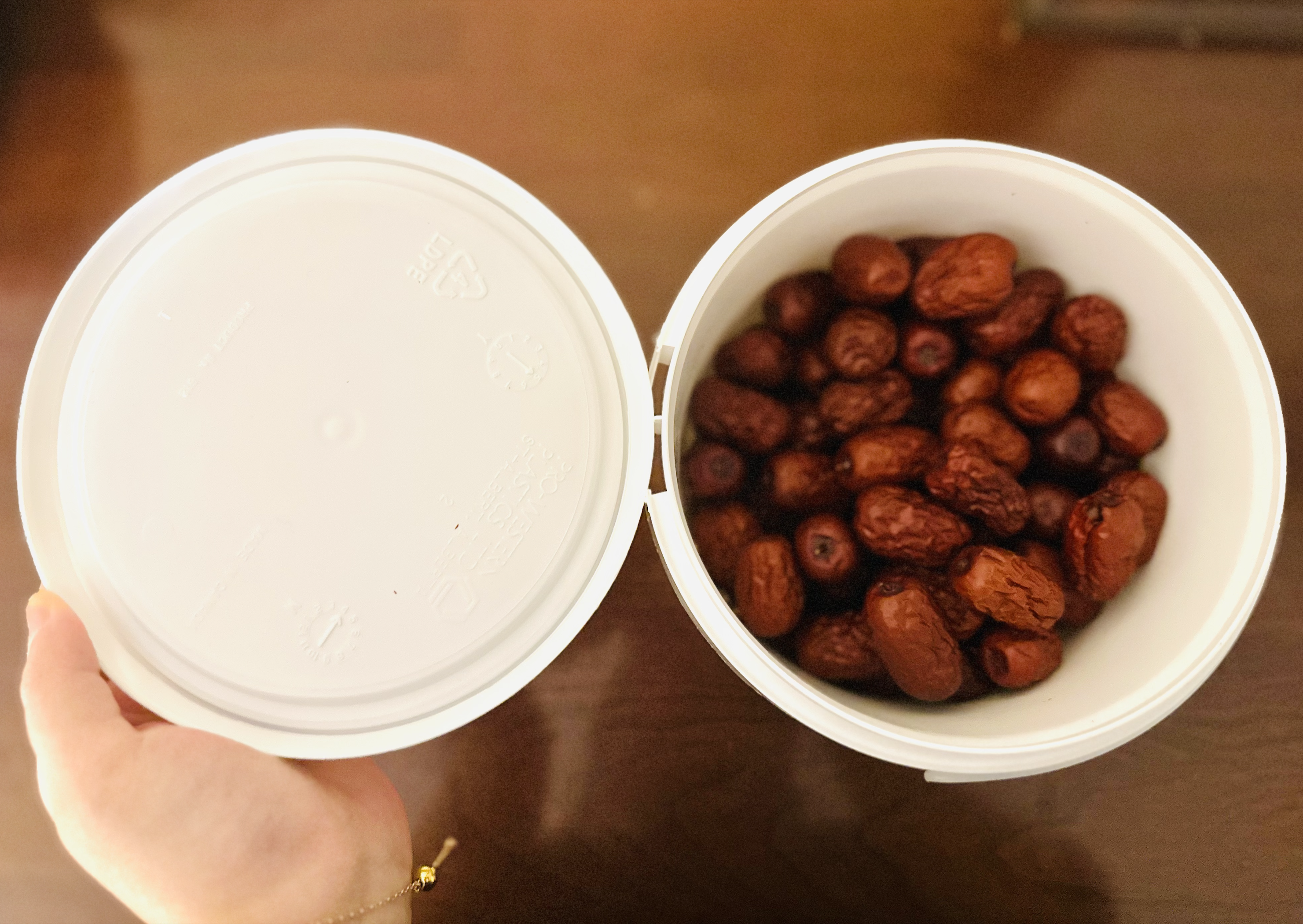 Close-up of the red date container lid showing the interlocking seal design